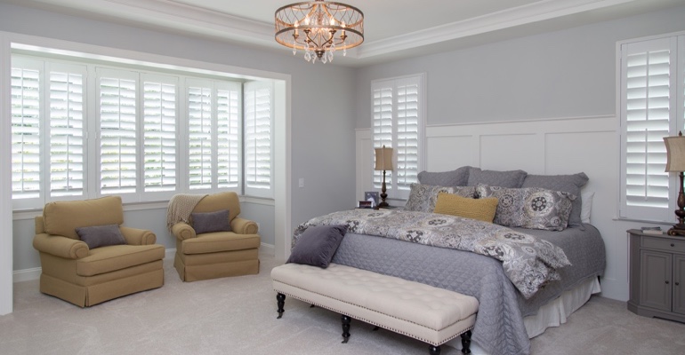 Plantation shutters in San Antonio bedroom.